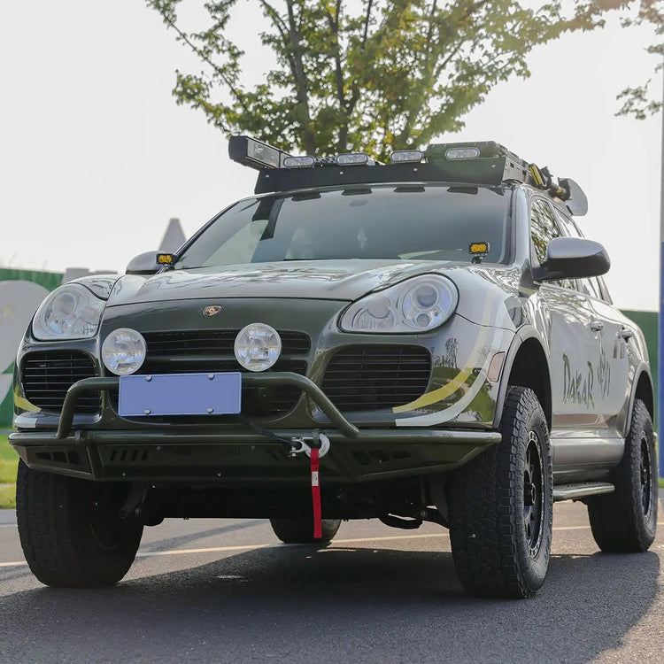 Porsche Cayenne 955 Gen 1 (2002–2007) front bumper with bull bar – light mount bracket and recovery point detail