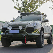 Porsche Cayenne 955 Gen 1 (2002–2007) front bumper with bull bar – light mount bracket and recovery point detail