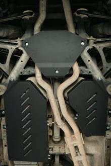 Porsche Cayenne 955/957 & VW Touareg manganese steel gas tank skid plate (2002–2010) — installed on vehicle underbody