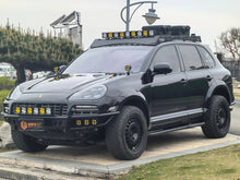 Porsche Cayenne 957 high-clearance front bumper (2008–2010) — installed detail with light mounts